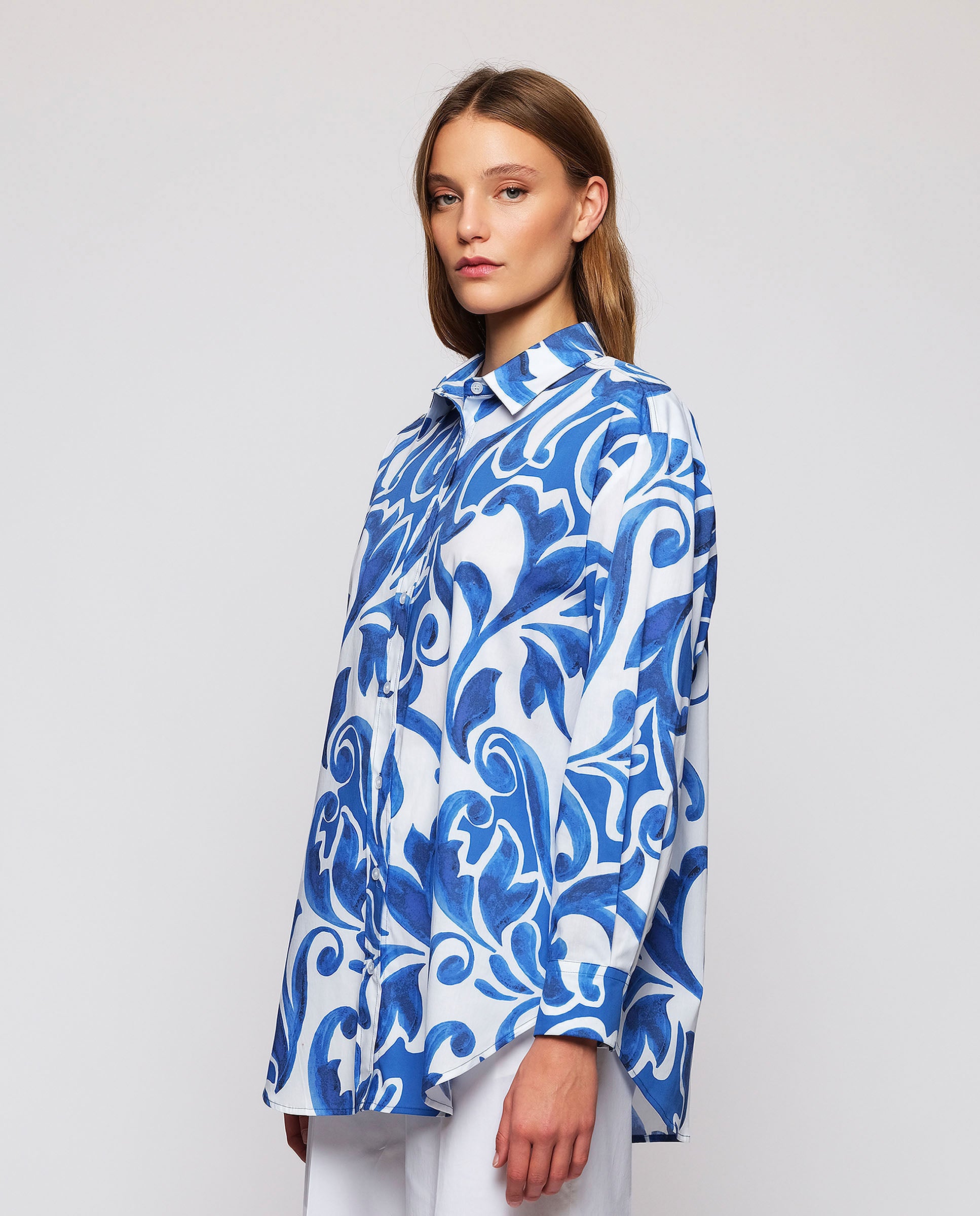 White shirt with  blue ornamental print by MIRTO