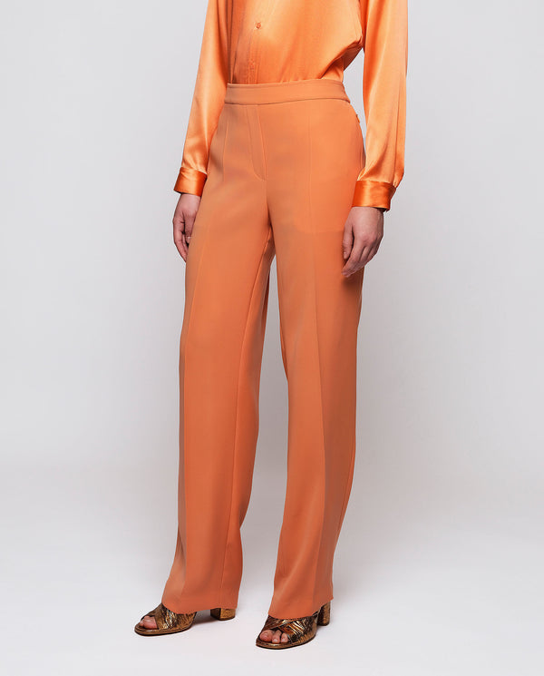 Orange fluid trousers by MIRTO