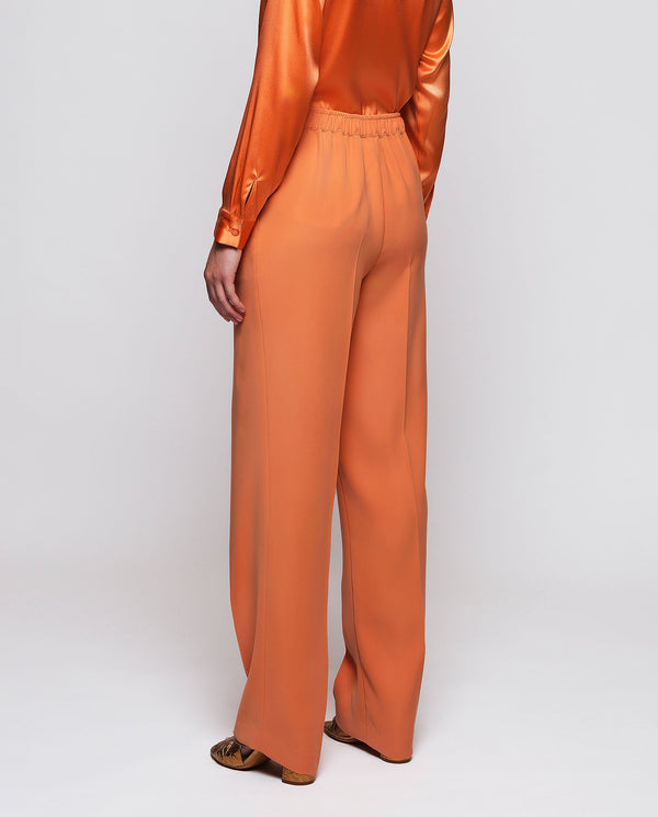 Orange fluid trousers by MIRTO