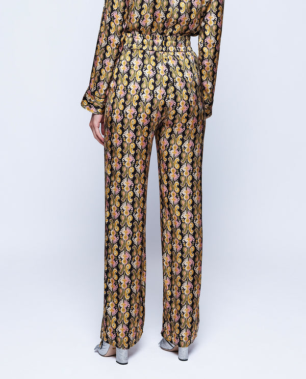 Black background paisley print trousers by MIRTO