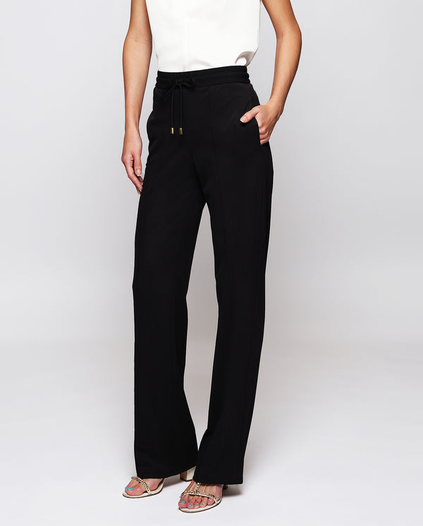 Black stretch technical fabric trousers by MIRTO
