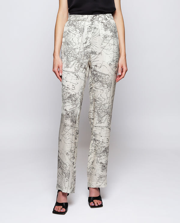 White figurative print fluid trousers by MIRTO