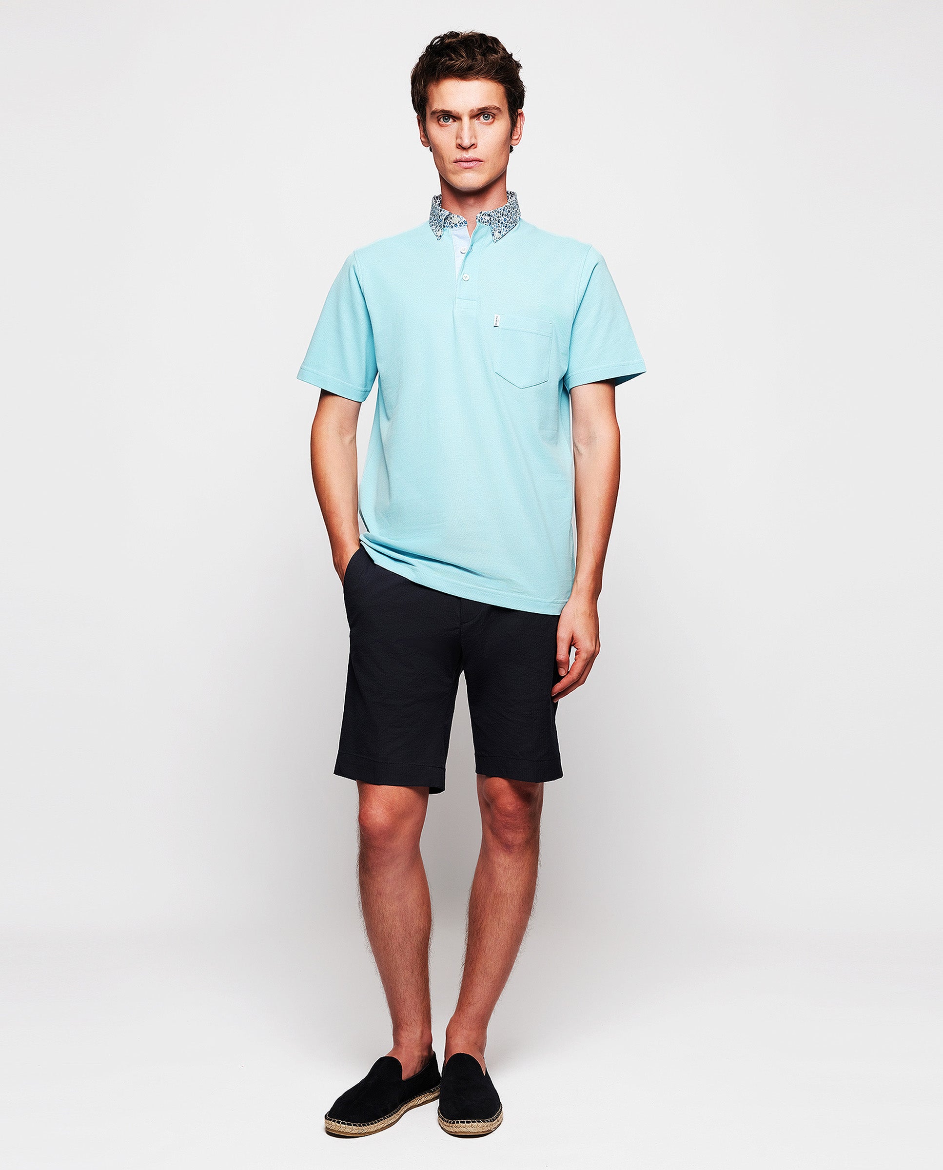 Light blue polo with breast pocket by MIRTO